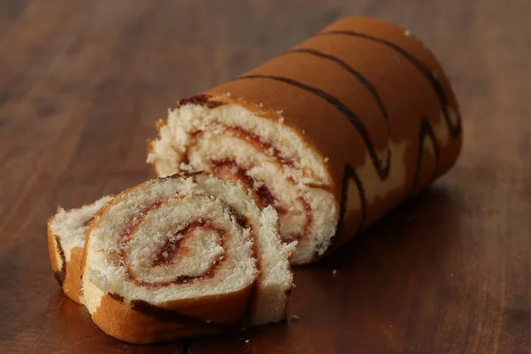 Sponge Cake Roll Strawberry Filling Wooden Background Dessert Biscuit Roll — Stockfoto