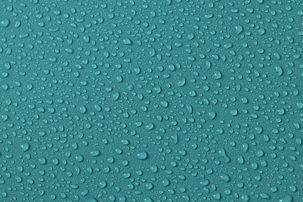 Water droplets on a colored texture. Decorative texture with water drops.