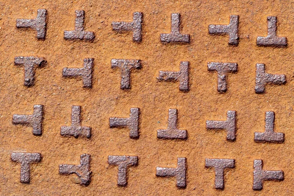 old rusty metal letters on a white background