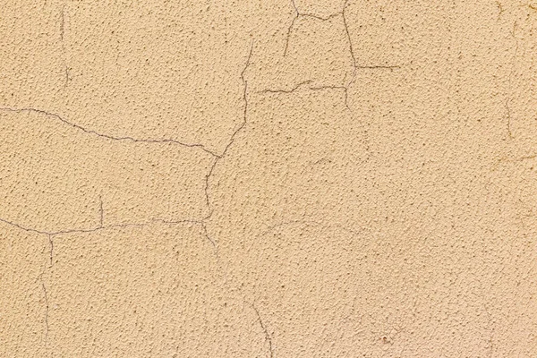 The texture of the plaster. Cracked plaster wall.