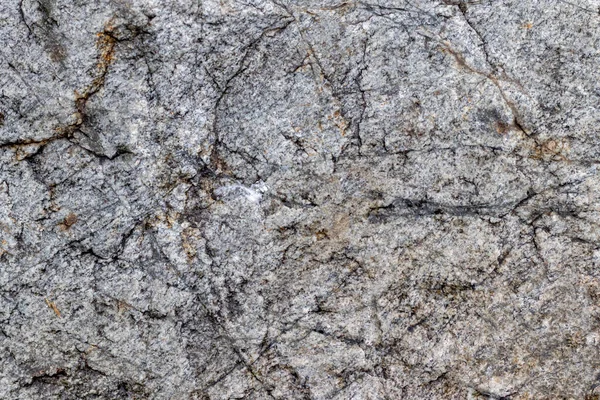 Textura Uma Parede Pedra Com Fendas Arranhões Que Podem Usar — Fotografia de Stock