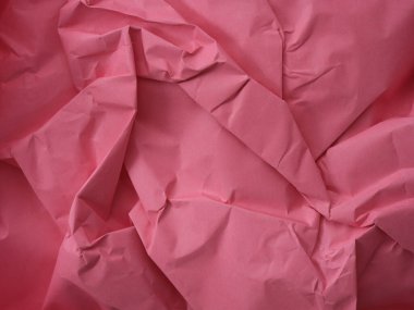 Pembe buruşuk bir arka plan. Kapat..