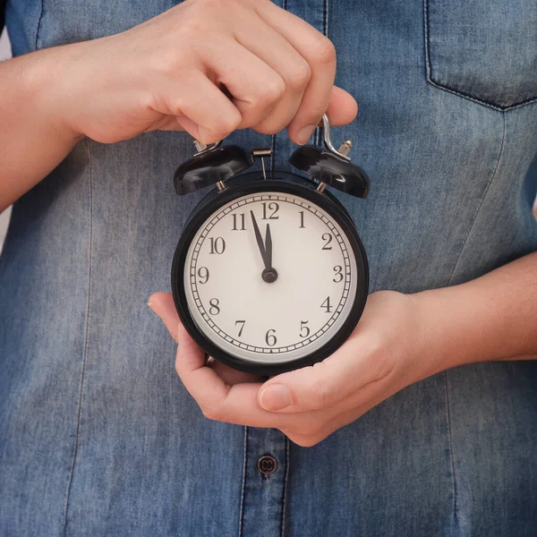 Woman Holding Alarm Clock Showing Few Minutes Twelve Her Hands — Stockfoto