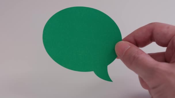 Man Holding Green Speech Bubble His Hand Close — Wideo stockowe