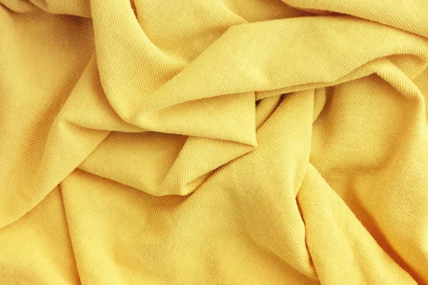 Light Yellow Crumpled Fabric Texture Background Close — стоковое фото