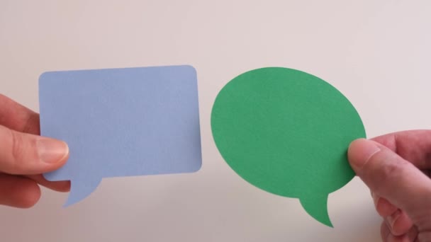 Man Holding Green Speech Bubble His Hand Woman Holding Blue — Stock Video