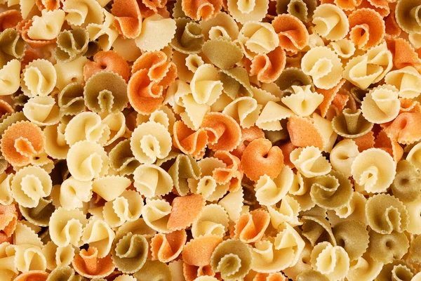 Closeup view of wheat pasta. Top view. Food background.