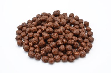 ready-made breakfast chocolate balls from whole grain wheat isolated on white background