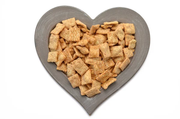 Whole Grain Flakes Cinnamon Pads Heart Shaped Frame White Background Stock Picture