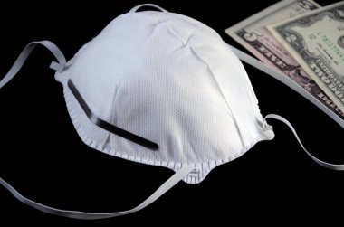 Siyah arka planda koruyucu maske ve dolar 