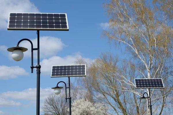 street lamps with solar panels in the park