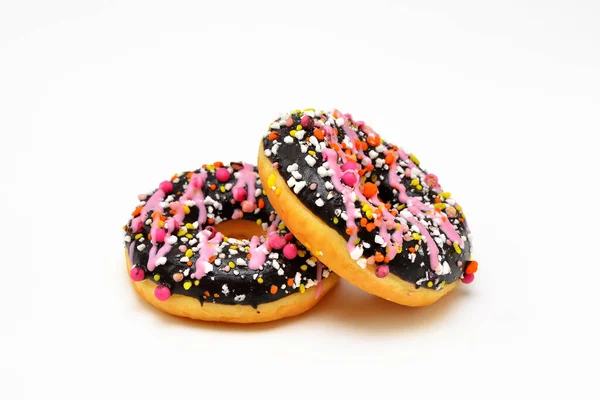 Twee Heldere Donuts Chocolade Glazuur Roze Hagelslag Close Een Witte — Stockfoto