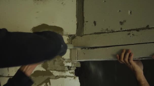 Man Hands Sawing Doorway Out Foam Block Hand Saw Concept — Stock Video