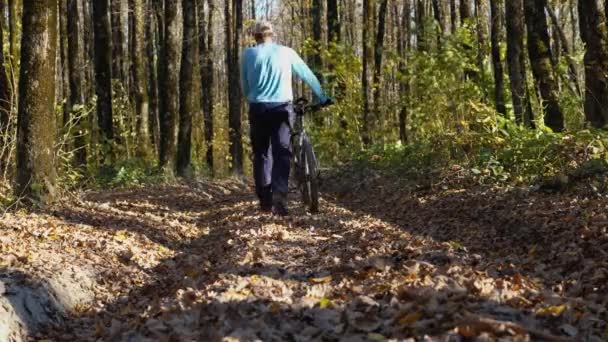 Man Pants Blue Shirt Cap Rolls His Mountain Bike Road — Wideo stockowe