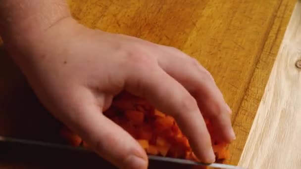 Close Woman Hand Using Knife Transfer Diced Carrots Cutting Board — Stock Video