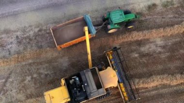 Harvester in harvest time in a wheat field. Navarre, Spain, Europe. Aerial view. 4K.
