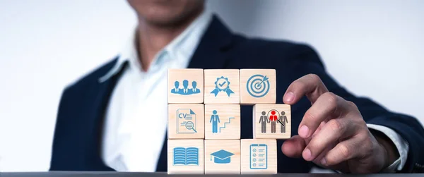a wood blog with icon Concept of job search, headhunting, recruiting procedure. there are icons for talents, education, qualification, interview, and application. Automation of hiring human resource
