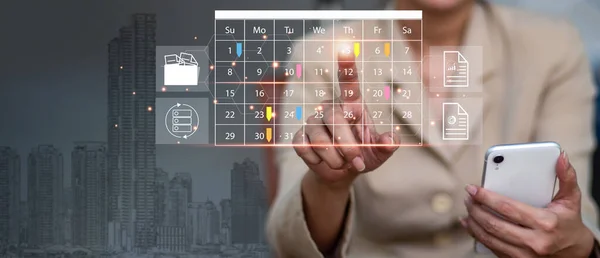 Reminder Appointment for the Calendar and the Organizer\'s Agenda Timetables and agendas used by event planners to organize and schedule activities. The woman on a phone, making notes on calendar app.