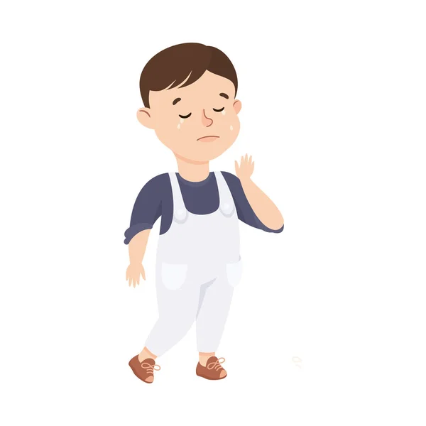 Kleine jongen in jumpsuit staan en huilen gevoel trieste vector illustratie — Stockvector