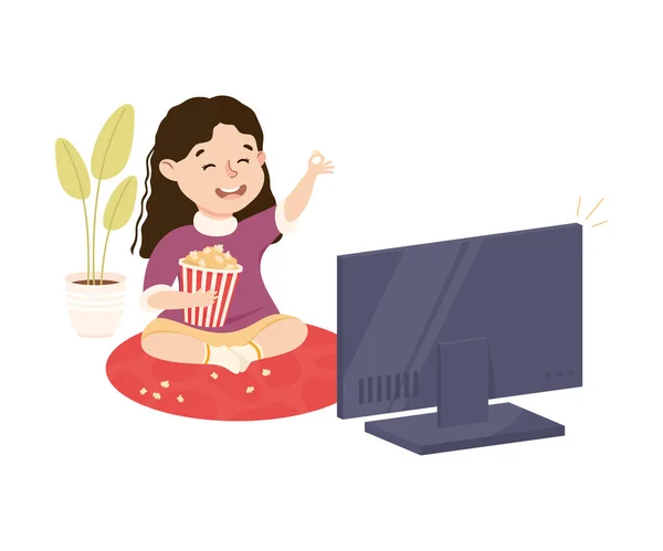 Mignonne fille assise sur le sol avec Popcorn et regarder la télévision Illustration vectorielle — Image vectorielle