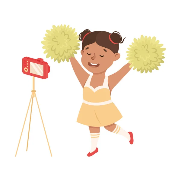 Mignon fille enregistrement vidéo avec caméra tout en Cheerleading Illustration vectorielle — Image vectorielle