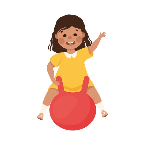 Usmívající se dívka skákání na míč a mávání rukou hrát a baví vektorové ilustrace — Stockový vektor