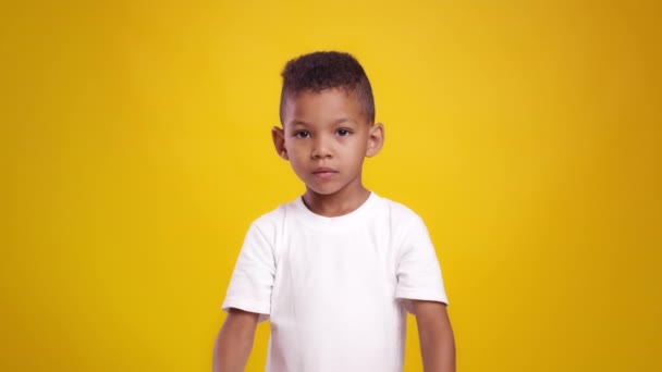 Stop kids abuse. Cute little african american boy crossing hands, showing rejection gesture to camera — Stock Video