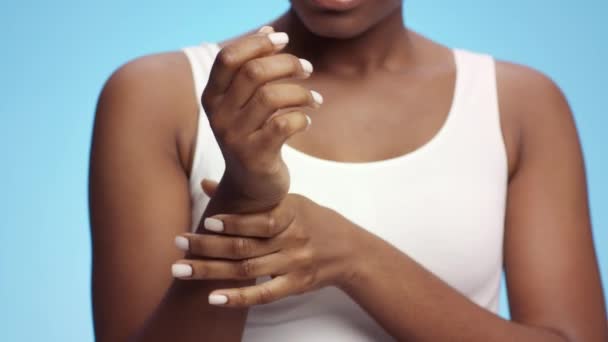 Office syndrome concept. Close up shot of unrecognizable black woman massaging her painful wrist — Stock Video