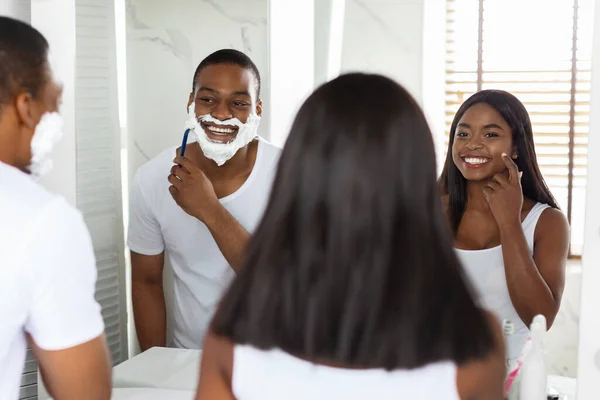 Young Black Couple Making Morning Self-Care Routine Near Mirror In Bathroom — Stok Foto