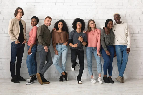 Multiracial group of cheerful young people posing over white — Stock Photo, Image