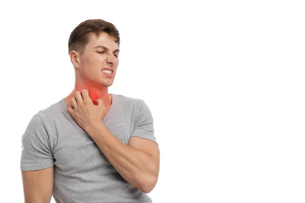 Sad young caucasian guy scratching neck, suffer from allergy, isolated on white background — Stock Photo, Image