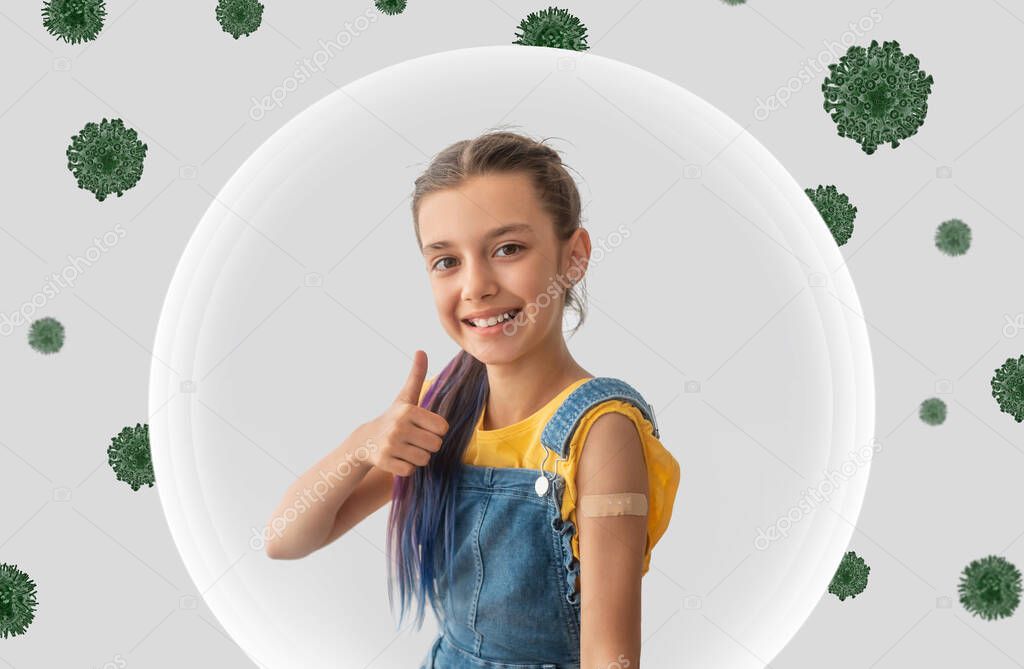 Happy european teen girl show shoulder with plaster after vaccination and thumb up sign, in bubble protection from virus