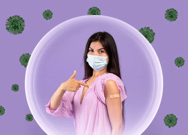 Cheerful caucasian millennial woman in protective mask shows band aid on hand after vaccination — Stock Photo, Image