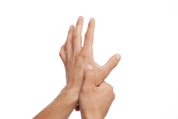 Onherkenbare jonge blanke man lijdt aan pijn in de arm en het drukken van de hand tot zere plek — Stockfoto
