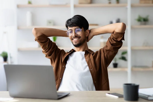 Wealthy indian guy project manager feeling good about his job — Stock Photo, Image