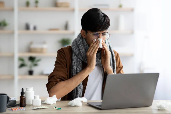 Photo of sick businessman sitting at worktable at office — Stock Photo, Image