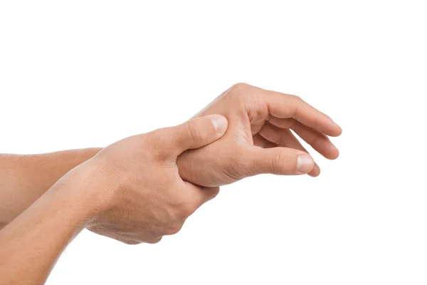 Jovem europeu cara massageando a mão e sofrendo de dor no pulso, isolado no fundo branco, close-up — Fotografia de Stock