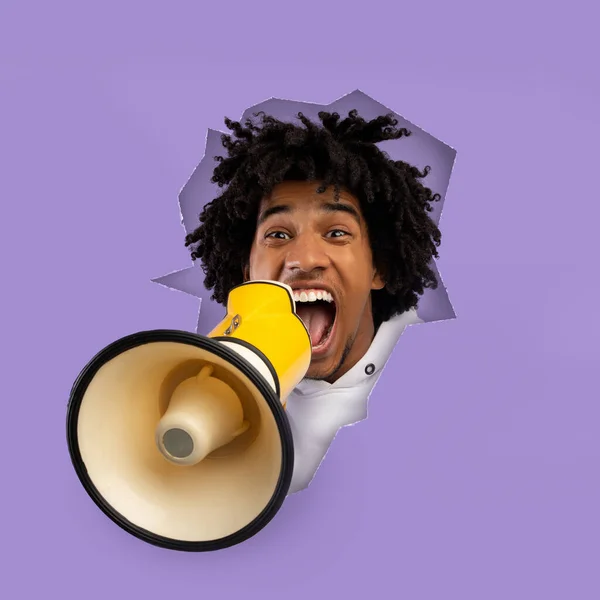 Cheerful excited emotional curly young african american guy shouts at megaphone — ストック写真