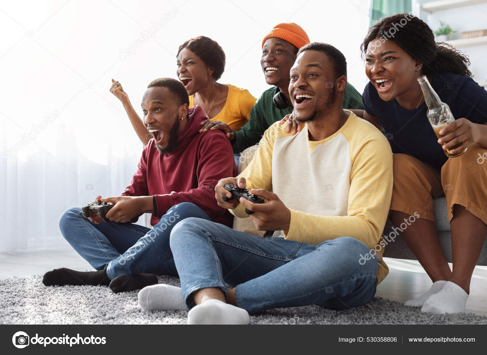 Young People Playing Video Games At Home Stock Photo, Picture and Royalty  Free Image. Image 113583143.