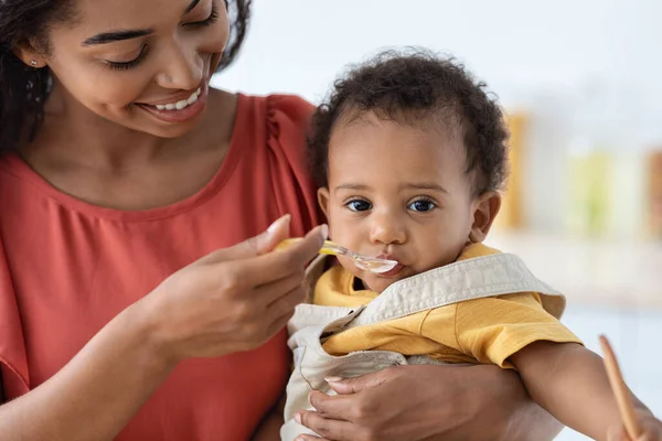 Adorable Little Black Baby Boy Eating From Spoon, Closeup Shot — Stock Photo, Image