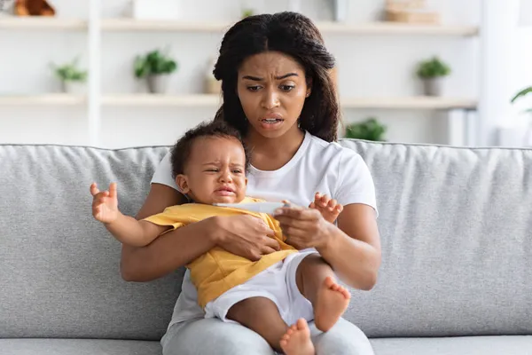 High Fever. Concerned Black Mom Checking Temperature Of Her Crying Infant Baby — Stock Photo, Image