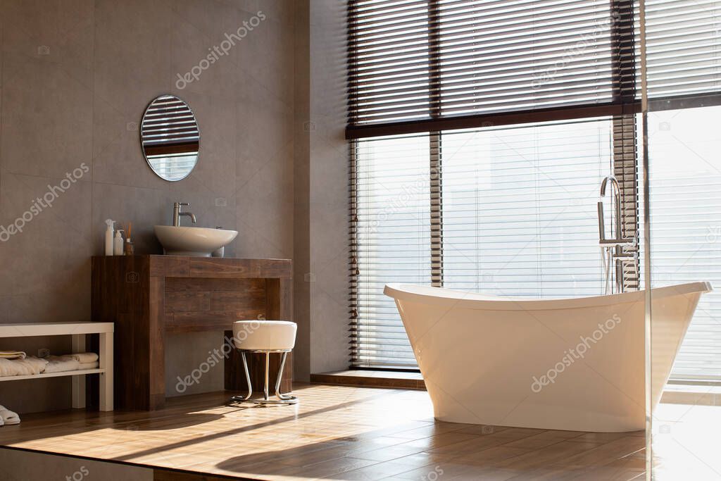 Modern bathroom with panoramic window in luxury apartment