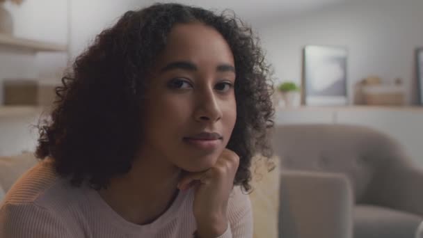 Natural beauty. Close up portrait of young peaceful curly african american lady smiling to camera, free space — Video Stock
