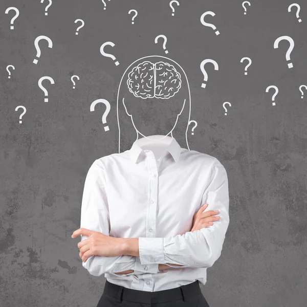 Collage of confused woman with drawing of head with brain and question marks on grey studio background — Stockfoto