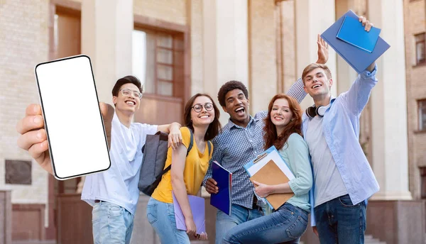 Happy Multicultural Students Posing Together Near Campus And Showing Big Blank Smartphone — ストック写真