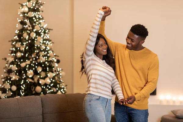 Black Couple Dancing Near Christmas Tree Celebrating New Year Indoor — Fotografia de Stock