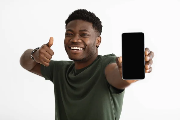 Cellphone with empty screen in black guy hand — 스톡 사진