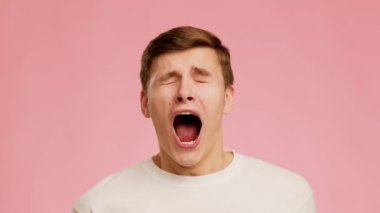 Surprised Guy Sneezing Looking At Camera Posing Over Pink Background