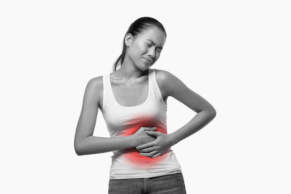 Sick lady suffering from abdominal pain, black and white shot — Stock Fotó