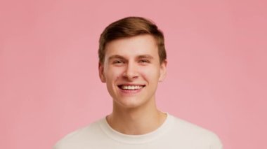 Millennial Guy Laughing Out Loud Having Fun Over Pink Background